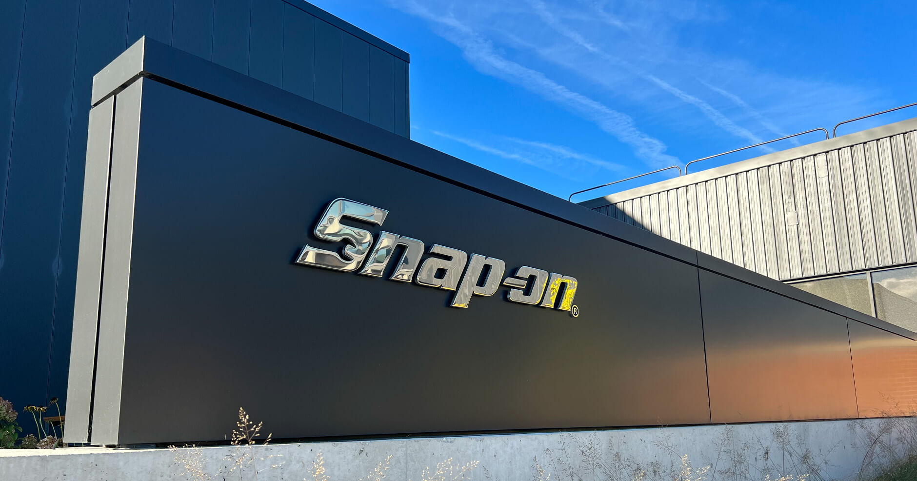 Snap-on exterior mirrored dimensional logo sign
